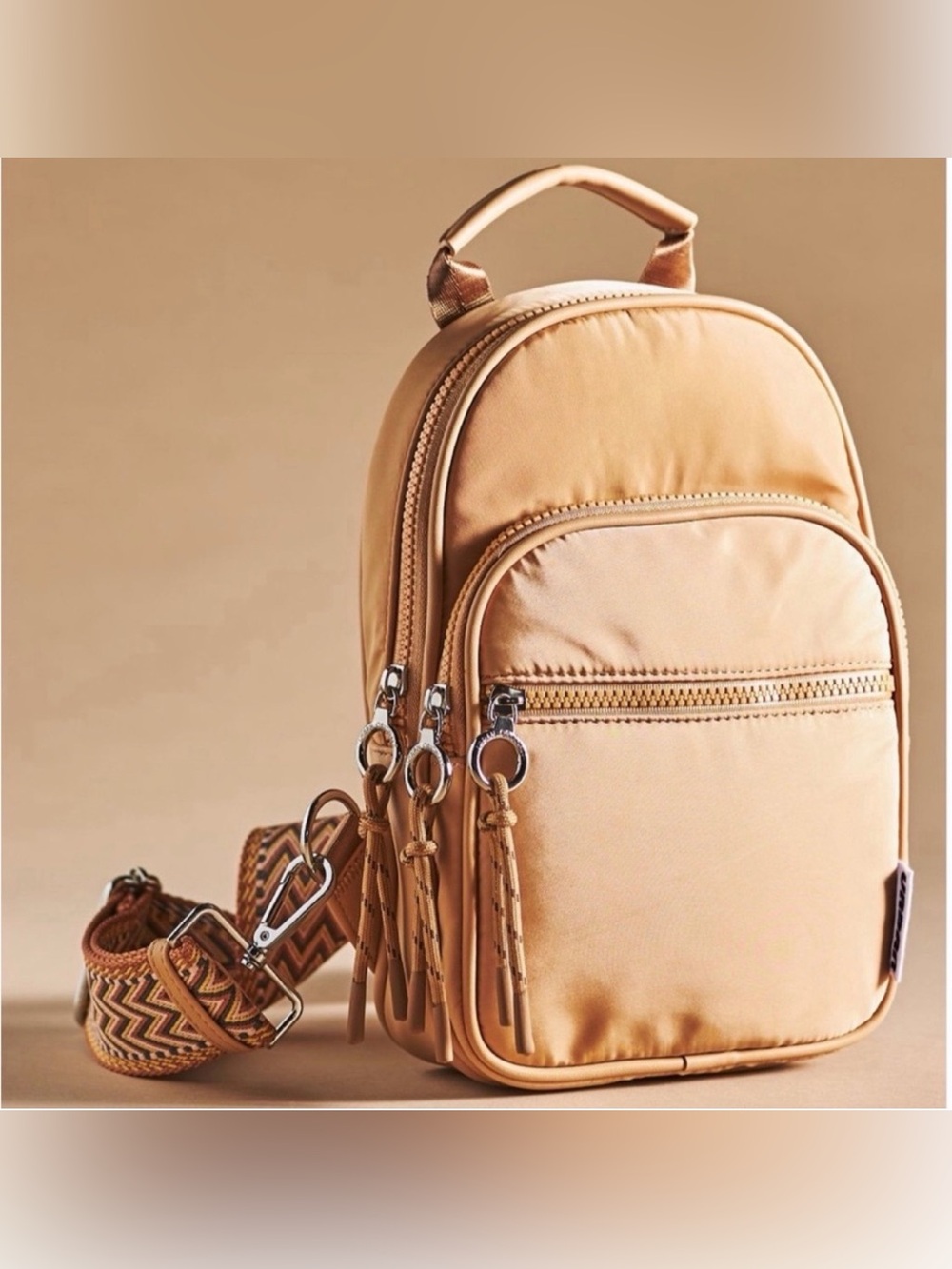 Anthropologie - Urban Originals - Convertible Sling Backpack in tan